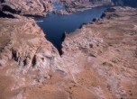Hole-in-the-Rock crevice with Lake Powell, Lamont Crabtree Photo